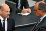 Německý kancléř Olaf Scholz (vlevo) a předseda CDU Friedrich Merz