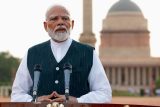 Indický premiér Naréndra Módí hovoří s médii po setkání s prezidentem Droupádím Murmuem, aby se zasadil o sestavení nové vlády v prezidentském paláci v Dillí, Indie, 7. června 2024