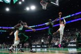 Atlanta Hawks forward Jalen Johnson (1) shoots against Boston Celtics guard Jaylen Brown (7) in the first quarter at TD Garden