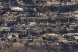 Letecký pohled ukazuje trosky ze spálených nemovitostí po požáru ve čtvrti Pacific Palisades v Los Angeles