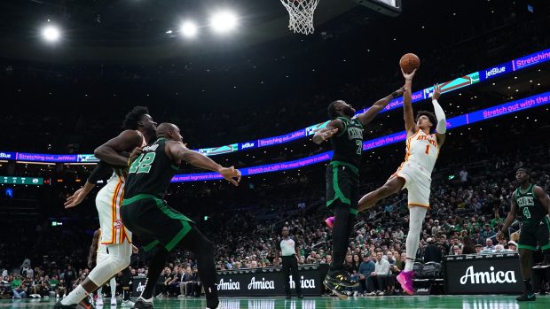 Atlanta Hawks forward Jalen Johnson (1) shoots against Boston Celtics guard Jaylen Brown (7) in the first quarter at TD Garden