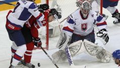 Slovakia&#039;s goalkeeper Jan Laco  (R) and Ivan Baranka (L) fight for puck with Canada&#039;s Jordan Eberle during their 2012 IIHF men&#039;s ice hockey World Championship quarter-final game in Helsinki  May 17, 2012