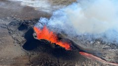 Lava spurts and flows after the eruption of a volcano in the Reykjanes Peninsula